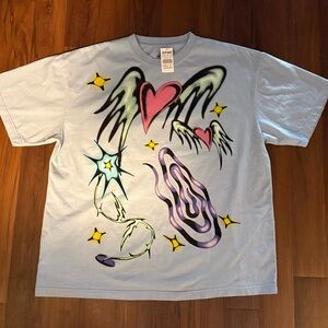 Blue Graphic Tee with Heart and Wing Design